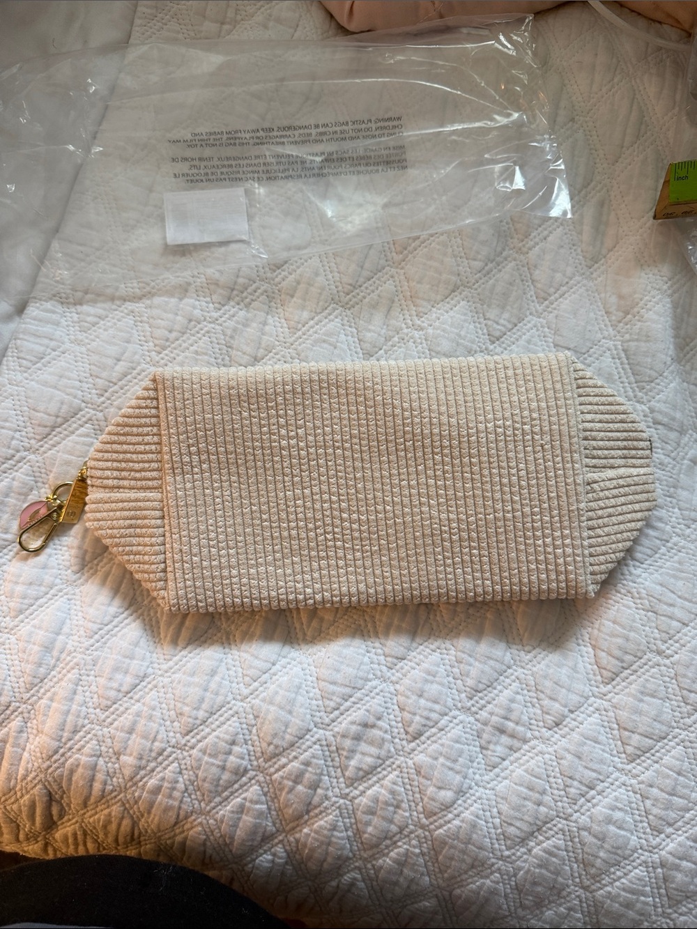tarte Cream Ribbed Cosmetic Pouch with Pink Lip Charm and Gold Hardware